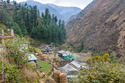 Hindu Temple in a Village of Lush green Great Himalayan National park Valley in Himachal Pradesh, India
 photo