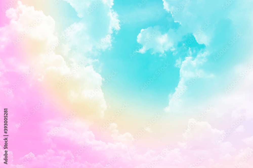 Pastel rainbow on white fluffy clouds, colorful blue sky on background