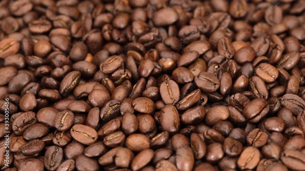 Coffee beans roasted arabica rotating. Coffee beans roasted arabica rotating.