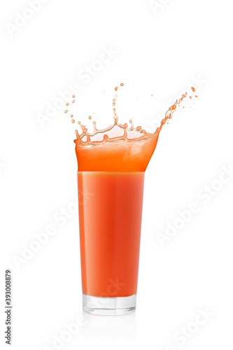 Juice splash in a glass on white background