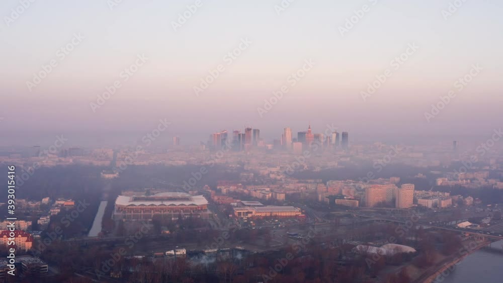 Warsaw skyline in the first morning light just above the fog. Drone shoot over the smog. Warsaw skyline in the first morning light just above the fog. Drone shoot over the smog.