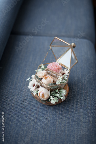 wedding ring on a cage with flowers