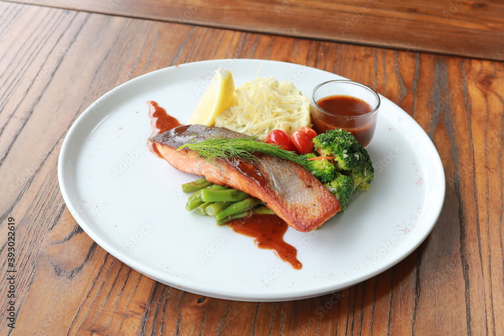 Grilled salmon with fresh vegetable salad