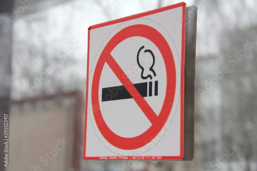 No smoking sign on glass door, concept of health care, smoking cessation.