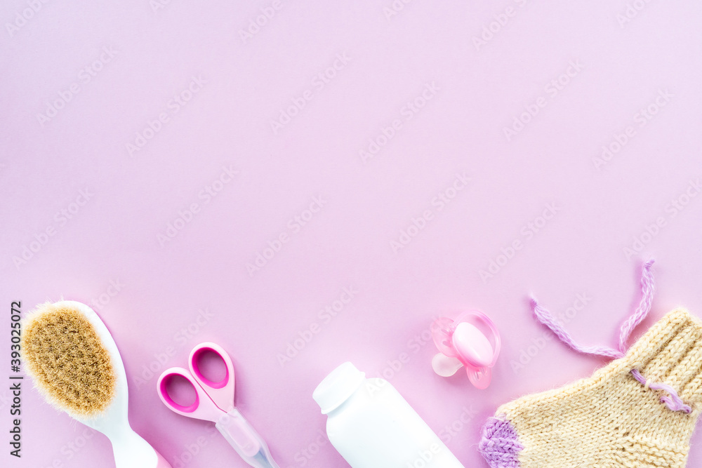 Baby care kit on pink background, top view, copyspace. Concept of children's hygiene. Flat composition with children's accessories, background.