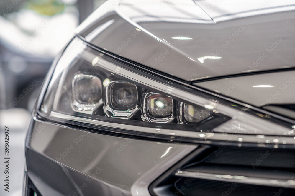 Close-up of new grey car front lights
