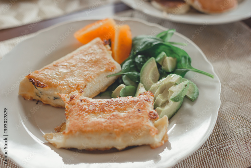 Tortillas with cheese, avocado, herbs and tomato. Tortillas with cheese, avocado, herbs and tomato.