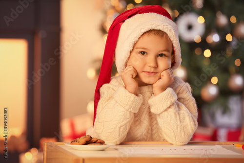 Cute little boy in Santa ha...