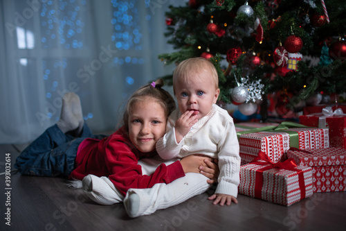 Two children near the Christmas tree