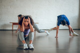 Woman feeling tired and disappointed during the dance class