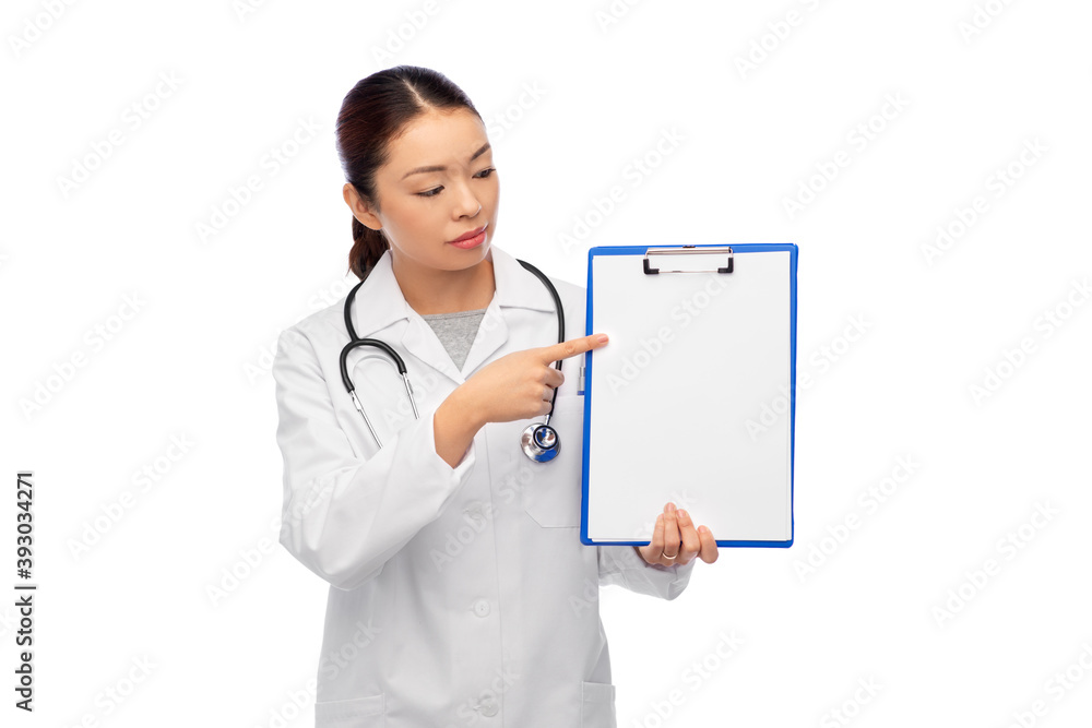 medicine, profession and healthcare concept - asian female doctor in white coat showing clipboard medicine, profession and healthcare concept - asian female doctor in white coat showing clipboard