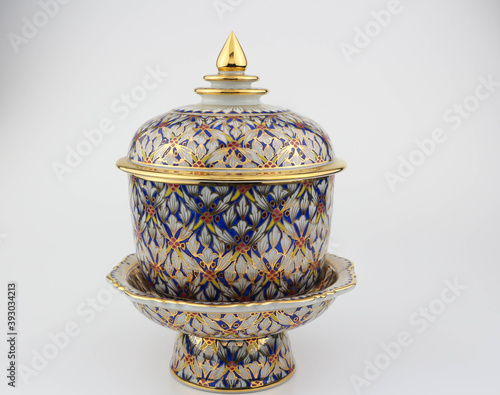 Thai traditional porcelain with lid on the pedestal called Benjarong - It contained of 5 colors art painted in the ceramic , high class art of Thailand isolated on white background