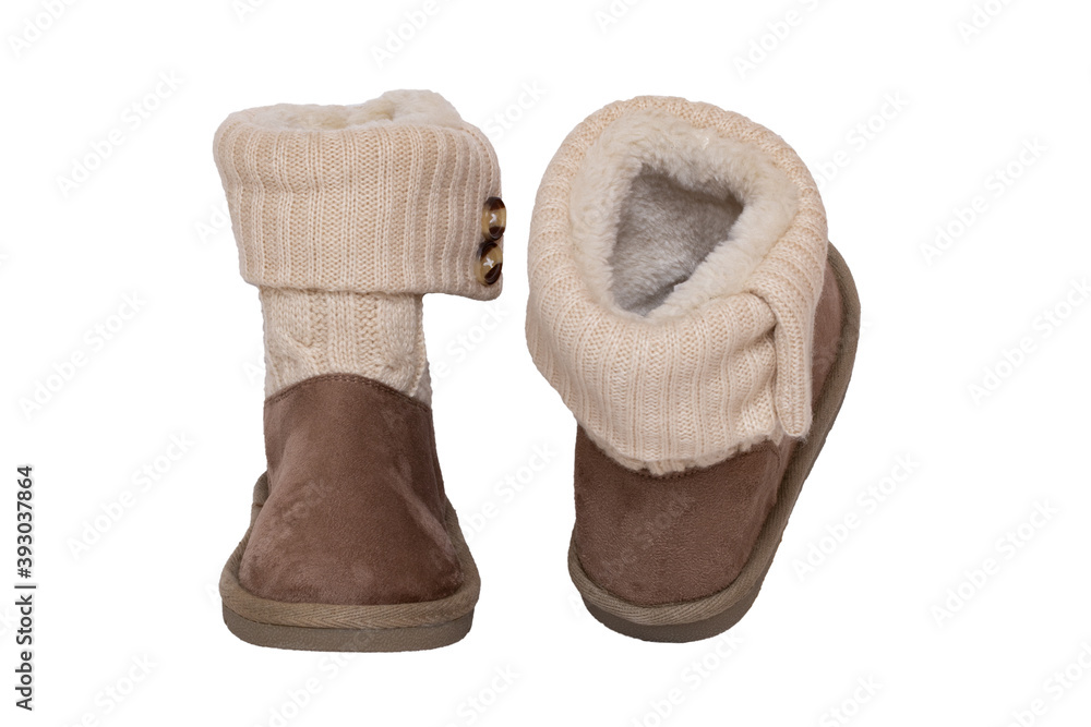 Winter boots. Close-up of a pair elegant brown suede leather winter boots with wool and lined with fur. Girls winter shoe fashion new collection. Isolated on a white background. Macro. Winter boots. Close-up of a pair elegant brown suede leather winter boots with wool and lined with fur. Girls winter shoe fashion new collection. Isolated on a white background. Macro.