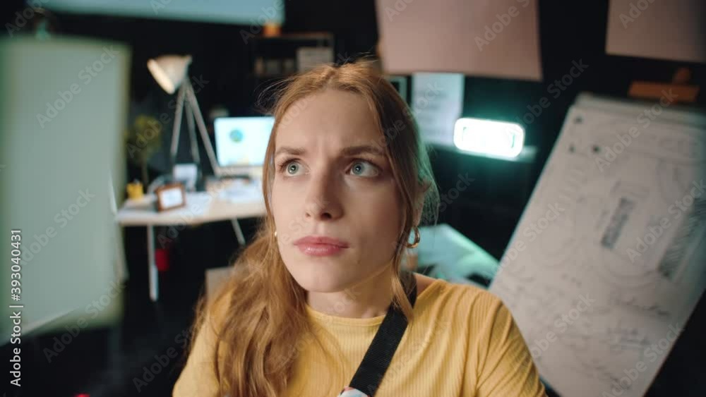 Focused business woman checking information on sticker board in hipster office. Focused business woman checking information on sticker board in hipster office.