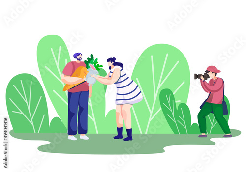 Photographer holds a photo session with clients in the park. Couple in love is photographed by the professional photographer with their rabbit. A man holding the carrot for his little rabbit