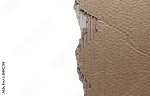 Torn, damaged cardboard for recycling isolated on white background with clipping path photo