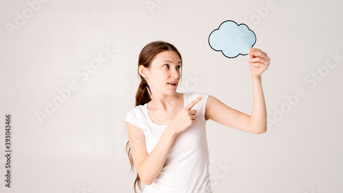 Young woman holding a speech bubble 