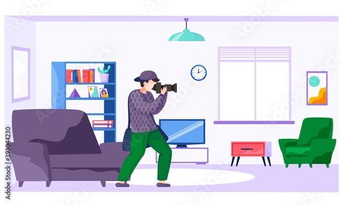 The guy standing and adjusting the lens. Photographer with a camera makes pictures in the apartment. Taking photos at home. Photographic art. A cameraman prepares camera for a future photo shoot