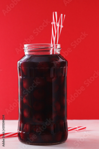 Cherry compote in a glass jar
