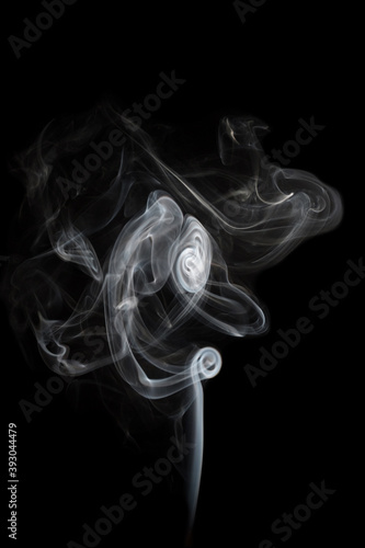 Abstract shape smoke in motion on a black background