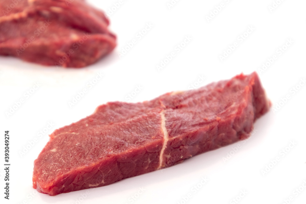 Fresh raw beef steak isolated on white background. Close up raw meat beef.