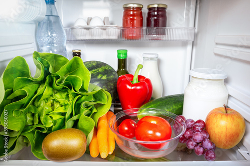 Variety of healthy foods inside a fridge