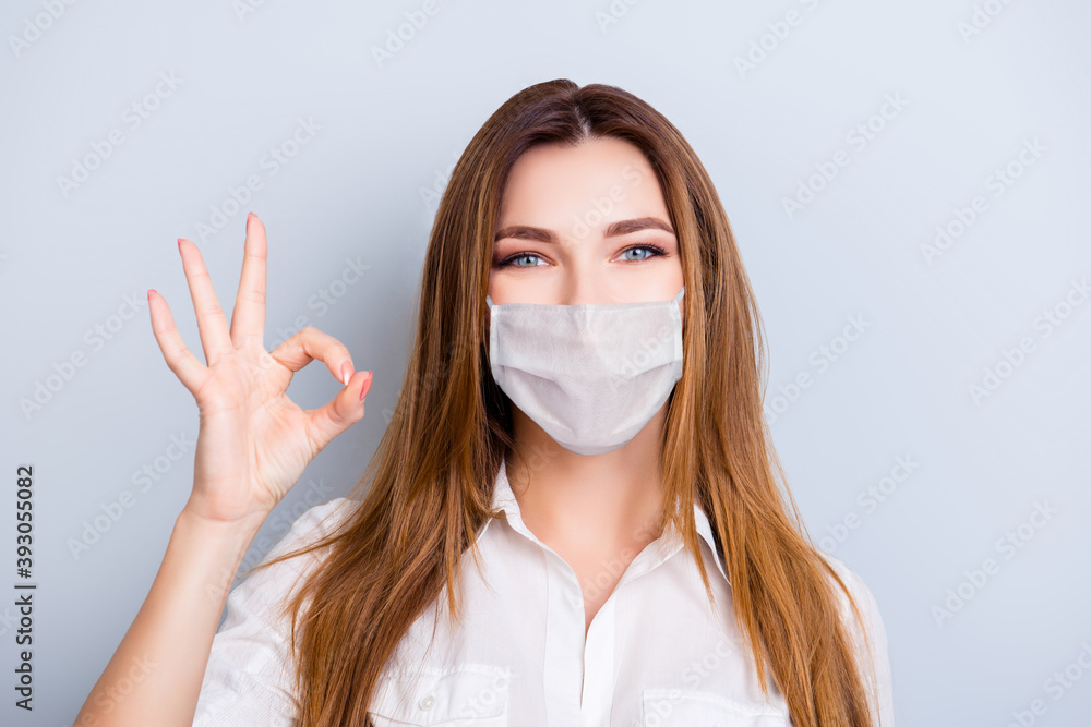 Well done Photo portrait of young attractive entrepreneur showing ok sign wearing white face mask isolated on grey background Well done Photo portrait of young attractive entrepreneur showing ok sign wearing white face mask isolated on grey background