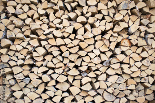 Birch firewood. Front image of cuts of firewood. The wood is dry and ready to light the fireplace. Wood background
