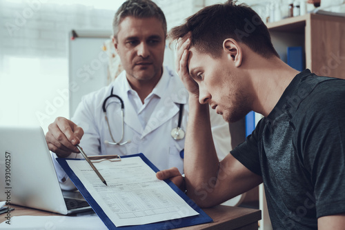 Man grabbed his head while looking at the invoice.