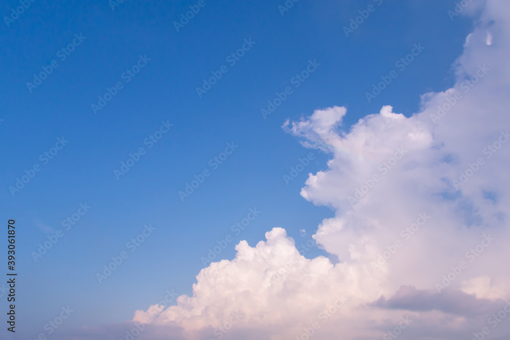 blue sky background with tiny clouds.