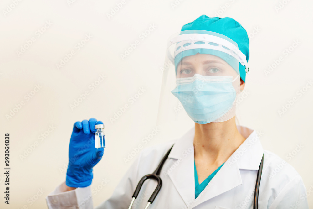 Doctor or nurse holding hands flu vaccine on beige background, measles injection syringe for baby, man, woman vaccination, medicine and drug concept. Vaccination against Coronavirus covid-19 pandemic Doctor or nurse holding hands flu vaccine on beige background, measles injection syringe for baby, man, woman vaccination, medicine and drug concept. Vaccination against Coronavirus covid-19 pandemic