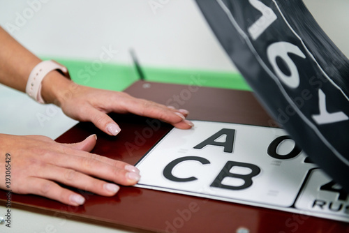 production of numbers for a car on a machine