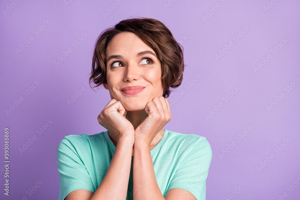 Close up photo of attractive tricky person arms on chin look empty space wear turquoise isolated on violet color background Close up photo of attractive tricky person arms on chin look empty space wear turquoise isolated on violet color background