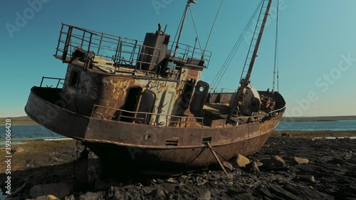 Abandoned ship on the shore of the Barents sea on the Rybachy Peninsula, Russia. Smooth camera movement.