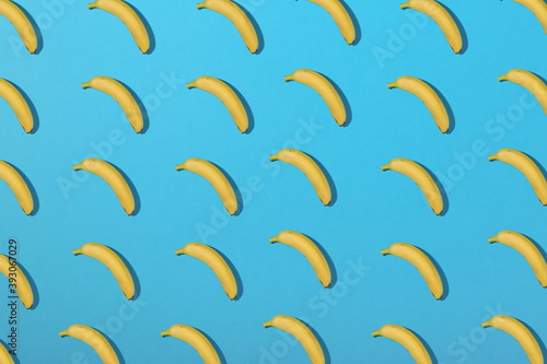  bananas pattern on blue background flat lay