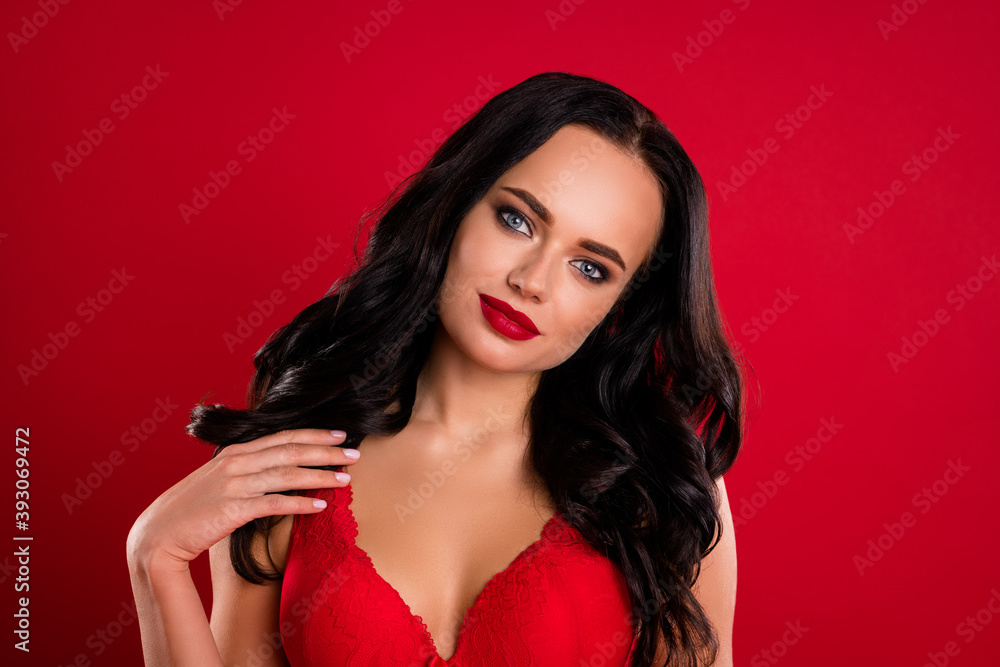 Naklejka premium Portrait of fantastic brown hairdo girl snow maiden wear bright bra isolated on red color background