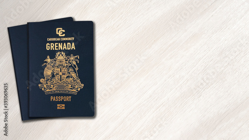 Grenada passport on a wooden background, space for texts