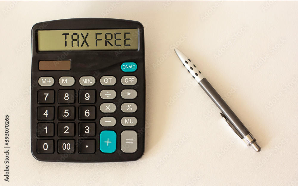 Calculator with text Tax Free on display and white background with pen. Place to write. Calculator with text Tax Free on display and white background with pen. Place to write.