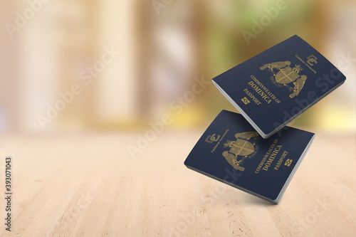 Two Dominica passports are on a wooden table, floating in the air ,Space for writing 