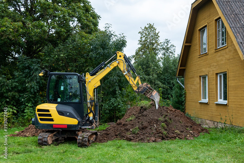 Excavator works on countryside.