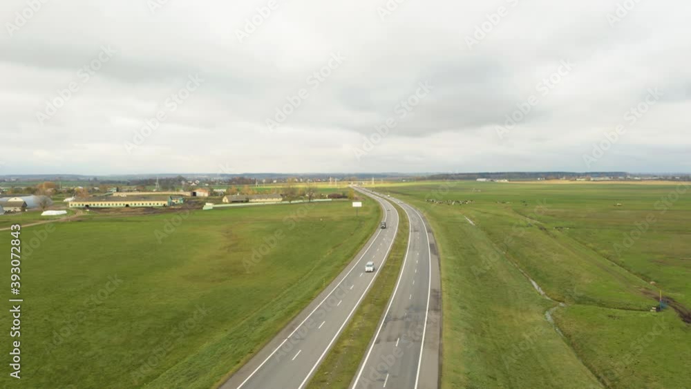 Aerial bird-eye view on freeway road and agricultural landscape in autumn season. Aerial bird-eye view on freeway road and agricultural landscape in autumn season.
