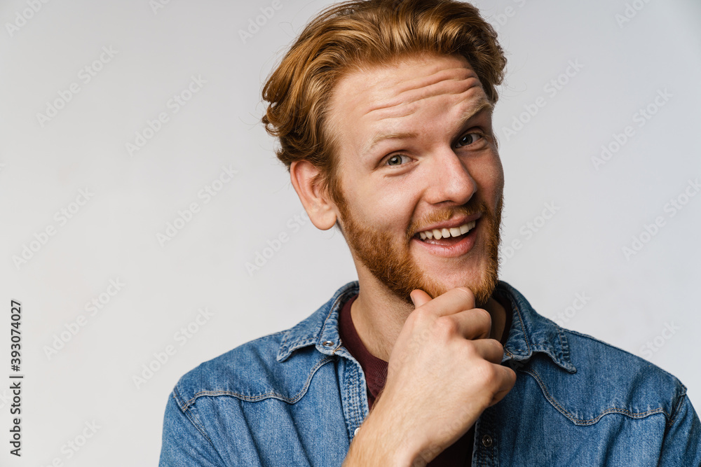 Joyful handsome guy smiling and looking at camera Joyful handsome guy smiling and looking at camera
