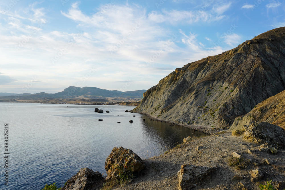 Fototapeta premium Mountain sea bay panorama. Beautiful Crimean nature landscape. Beautiful seashore with different stones.