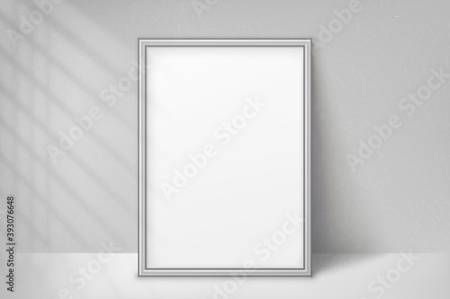 Mockup silver frame photo. Shadow on wall. Mock up artwork picture framed. Vertical boarder. Empty board a4 photoframe. Modern plastic 3d border for design prints poster, blank, painting image. Vector