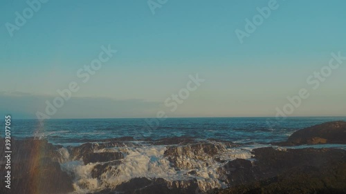 A large wave breaks on the coast of the Barents sea on the Rybachy Peninsula. photo