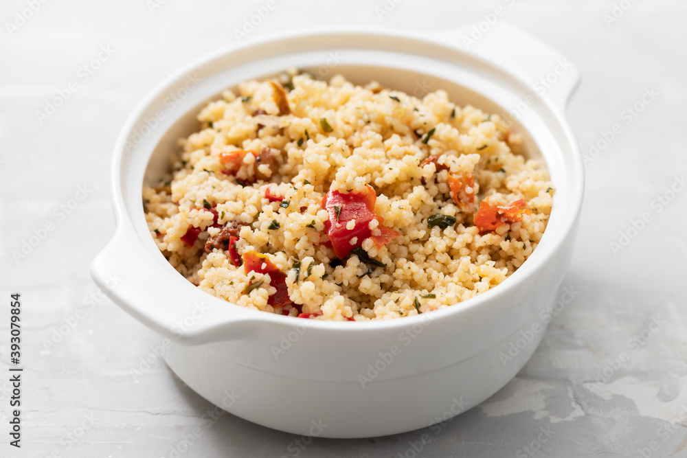 tabbouleh on small white bowl on ceramic background tabbouleh on small white bowl on ceramic background