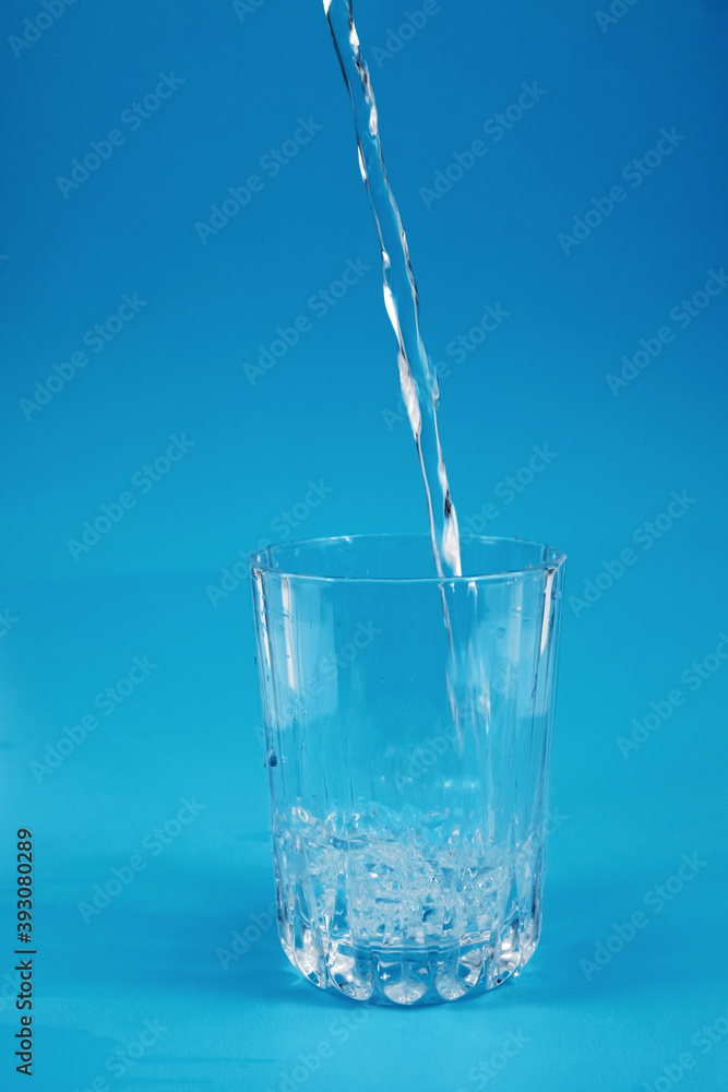 Pouring drinking clean water into the glass Pouring drinking clean water into the glass