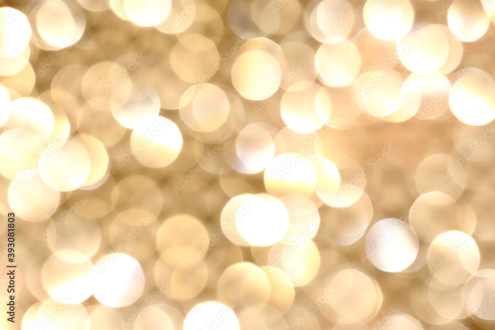 Shiny festive background. Gold color background. Blurred background