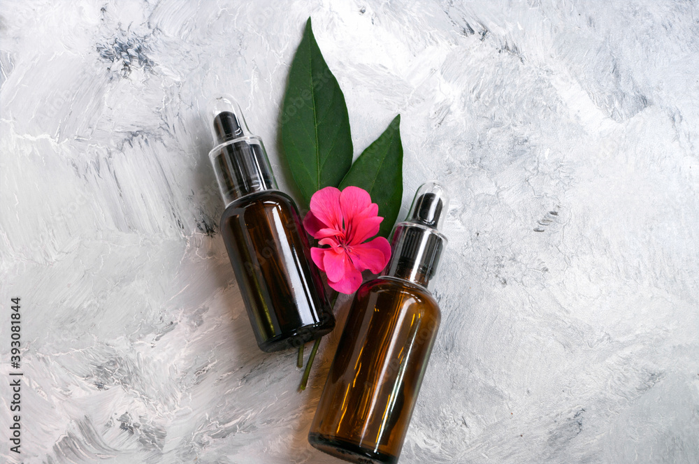 Glass cosmetic bottle with dropper. Natural serum skin care concept. Beauty product. Copy space for text. Glass cosmetic bottle with dropper. Natural serum skin care concept. Beauty product. Copy space for text.