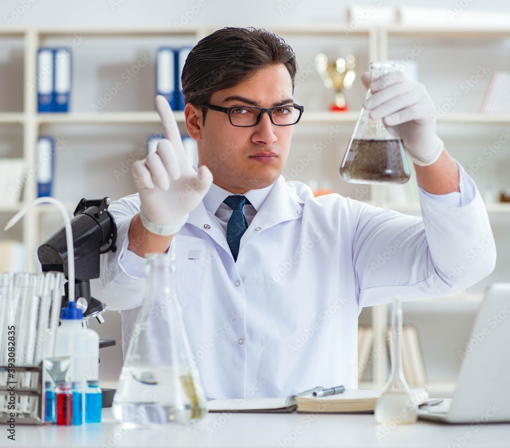 Young researcher scientist doing a water test contamination expe Young researcher scientist doing a water test contamination expe